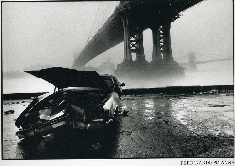 Crashed car under a bridge