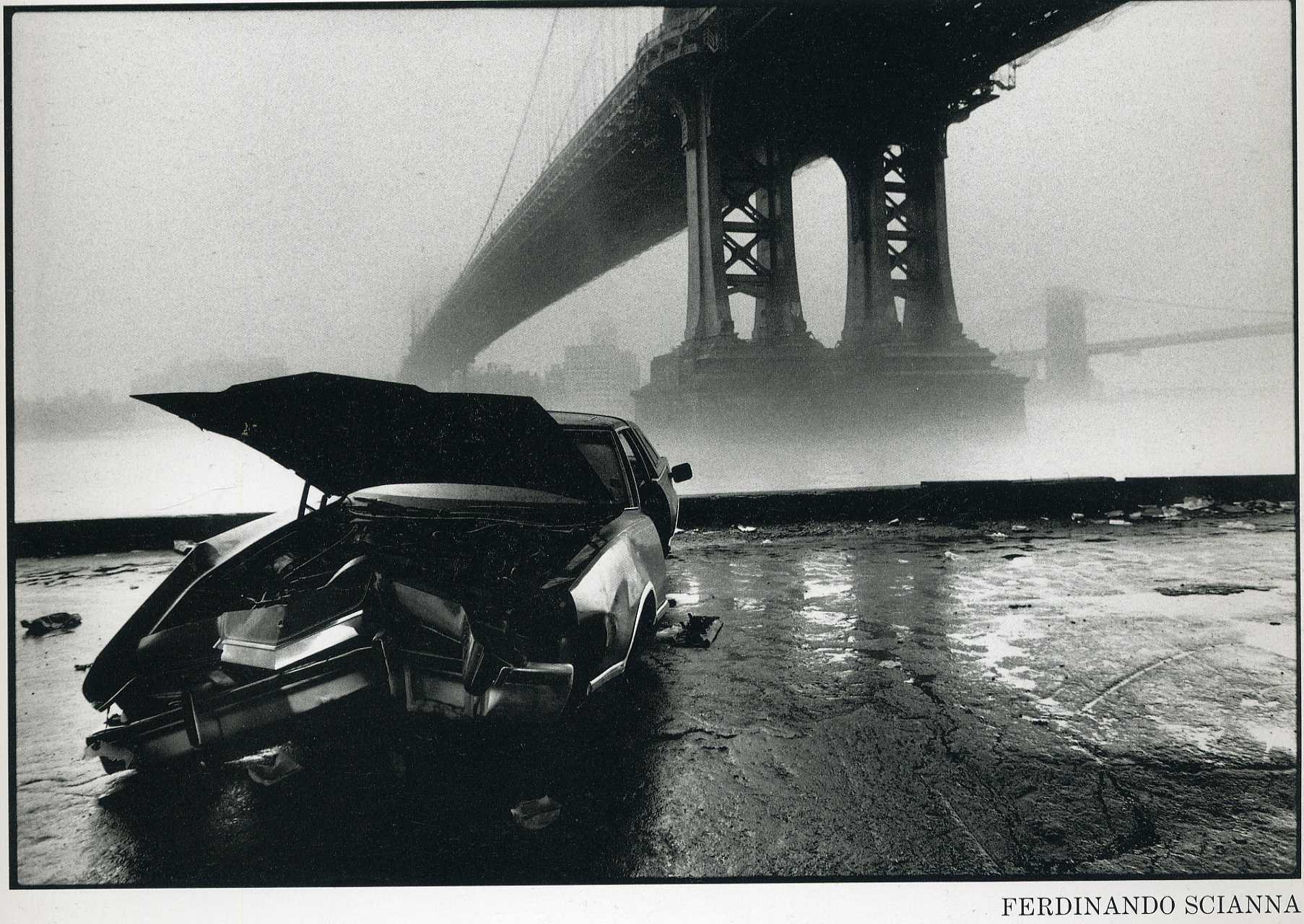 Crashed car under a bridge