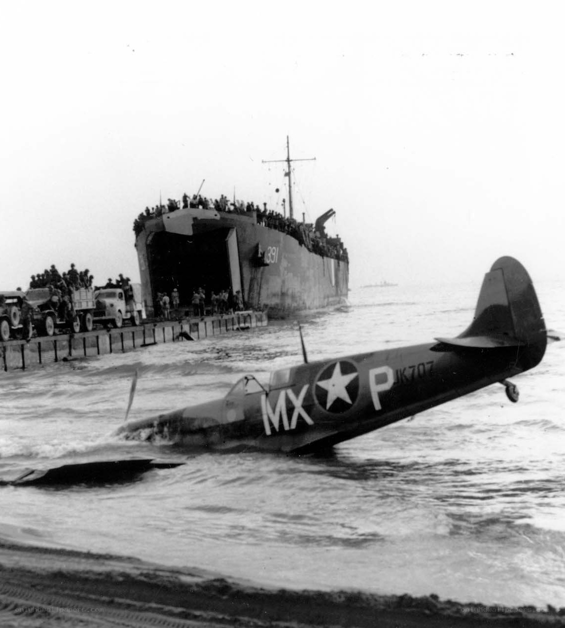 Crashed plane near landing ship