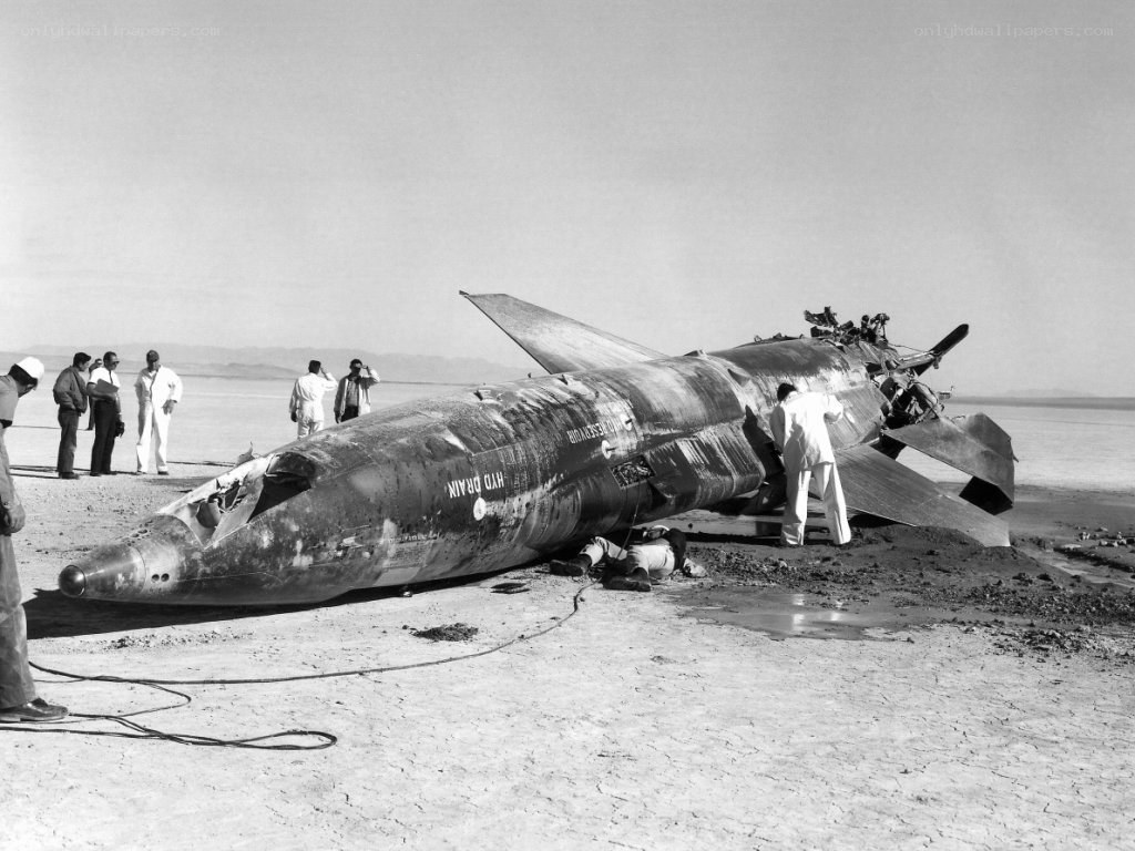 Crashed rocket on desert floor