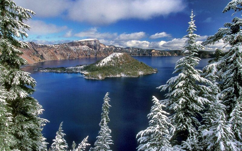 Crater Lake in Winter — Blue, Serene, Photograph, Snow-covered Trees, Island, Mountains