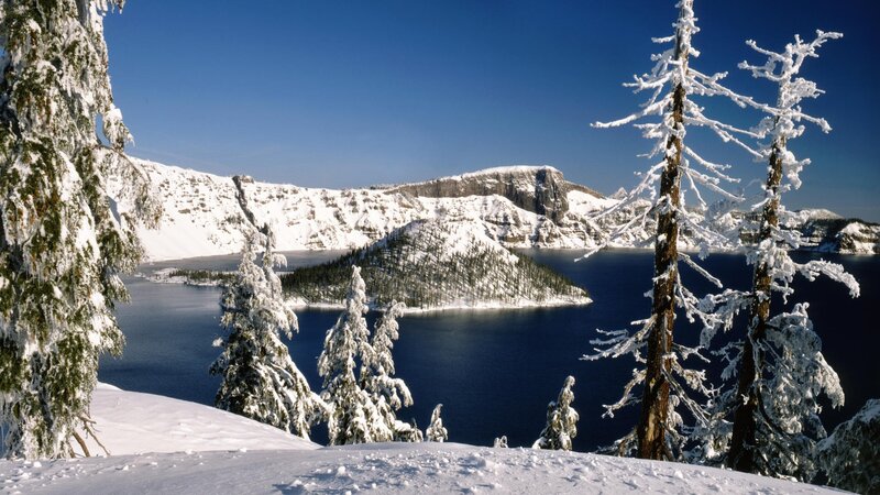 Crater Lake in Winter — Blue, Serene, Photograph, Snow-covered Trees, Island, Mountains, White, Green