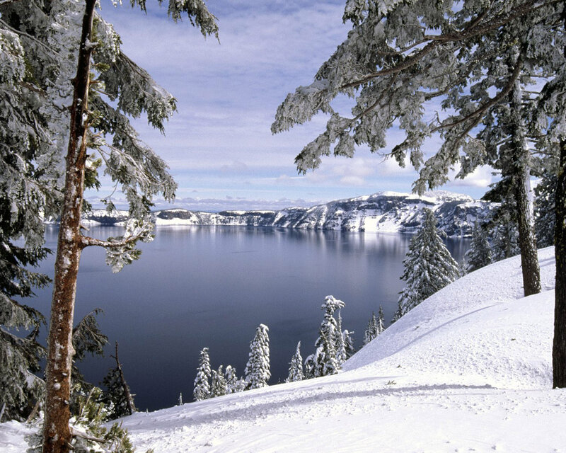 Crater Lake in Winter — Blue, Serene, Photograph, Snow-covered Trees, Mountains