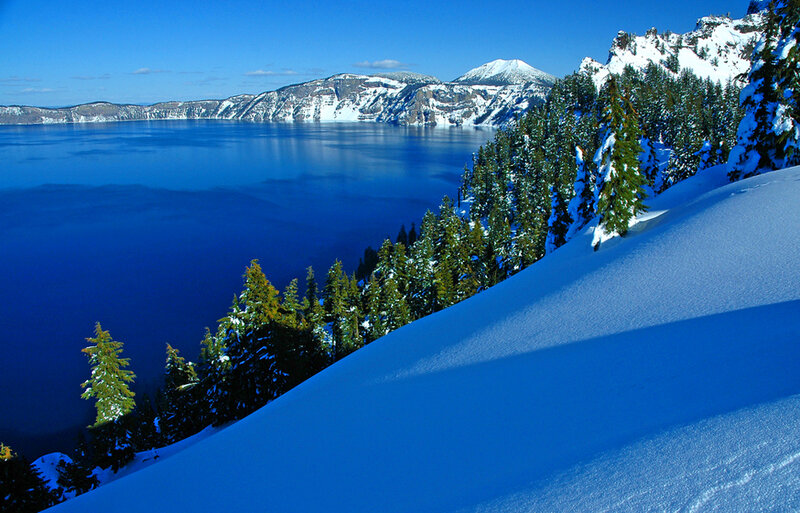 Crater Lake in Winter — Blue, Serene, Photograph, Snow-covered Trees