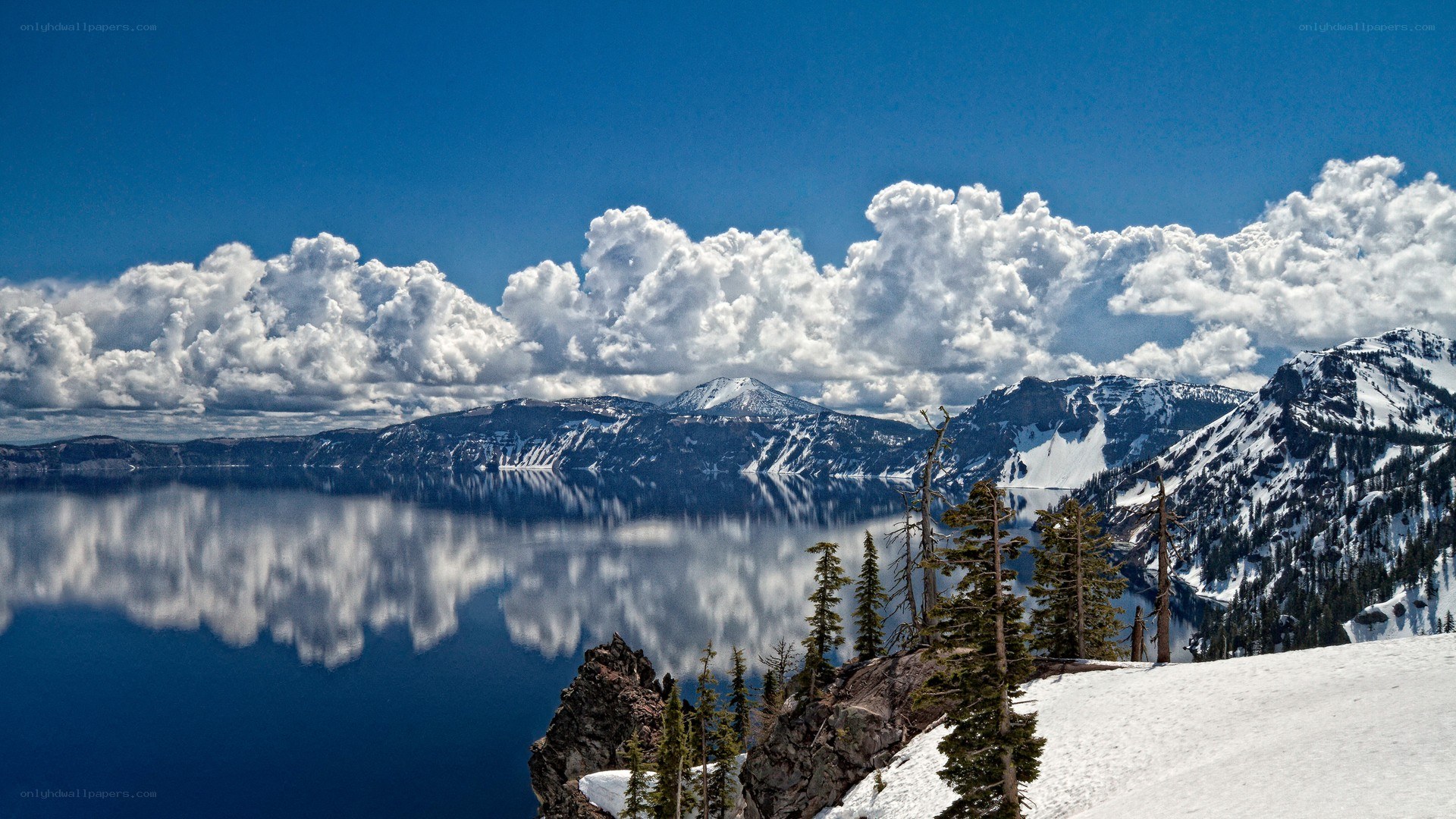 Crater Lake with snow-capped mountains