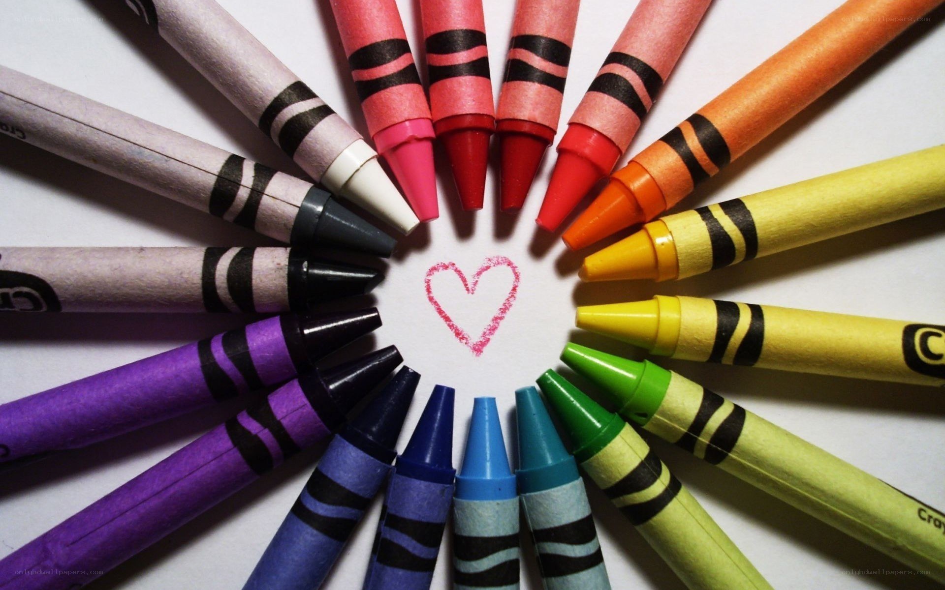 crayons arranged in a heart
