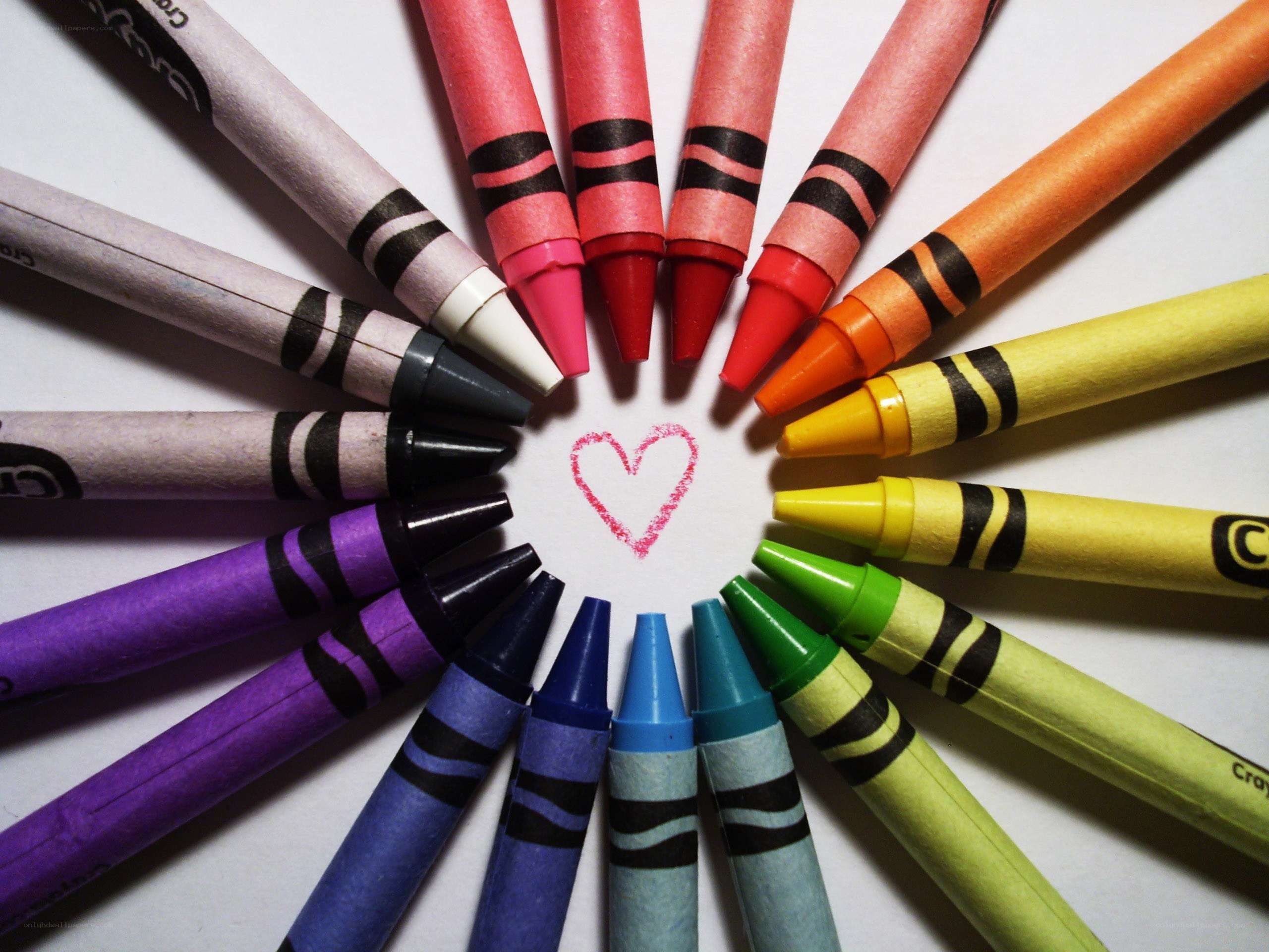 crayons arranged in a heart