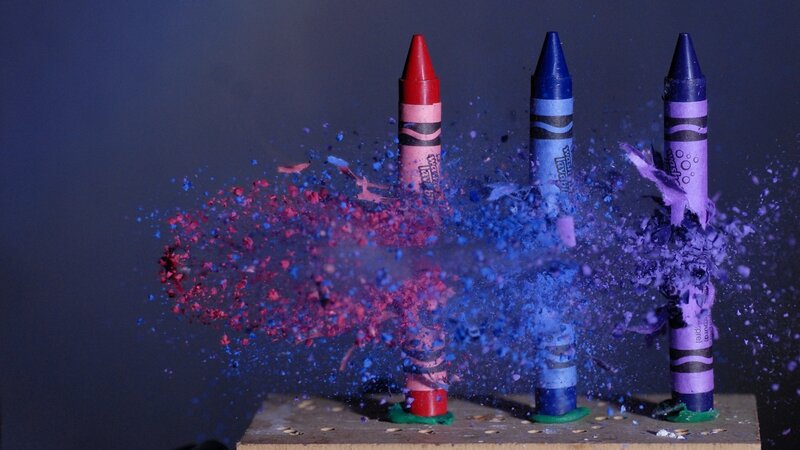 crayons exploding in slow motion