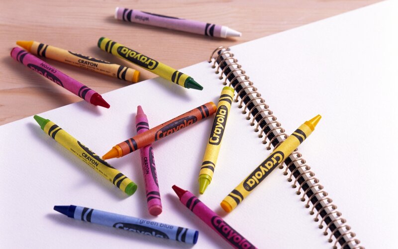 Crayons on a sketchbook