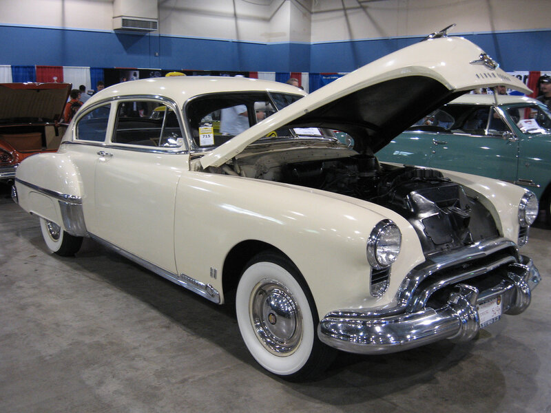 cream-colored classic car on display