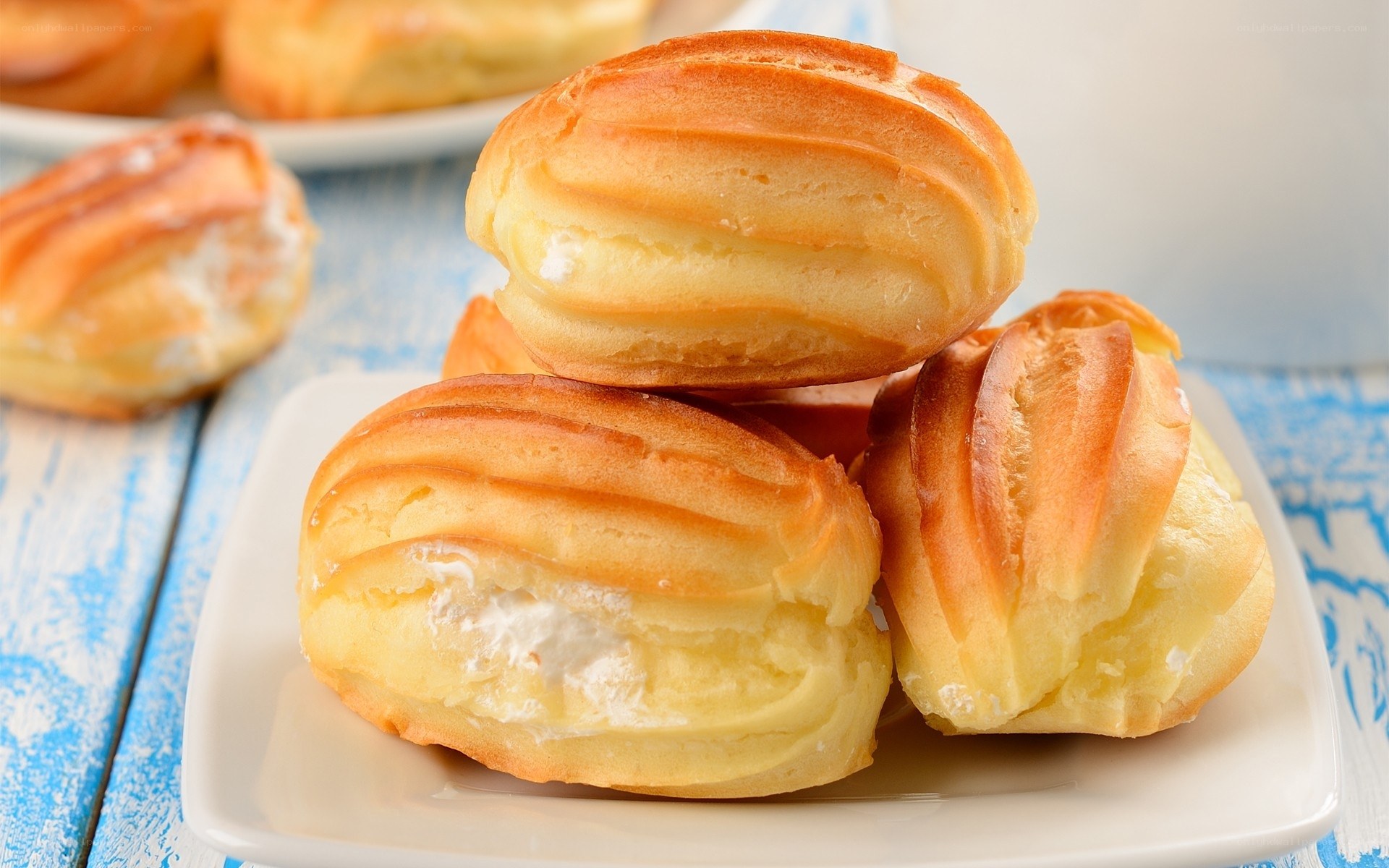 cream-filled pastries on a plate