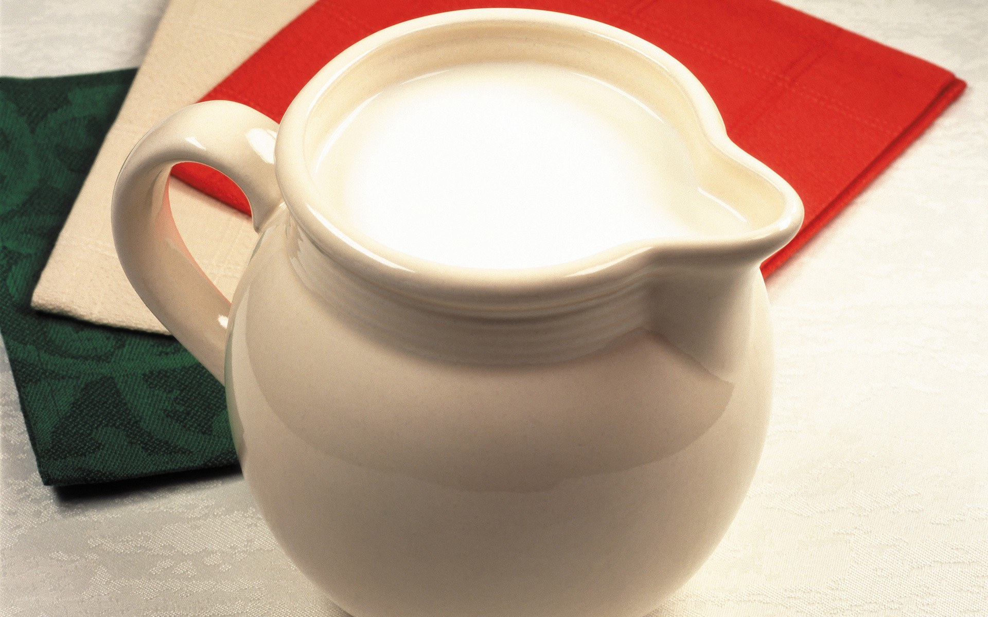 Cream pitcher on napkins
