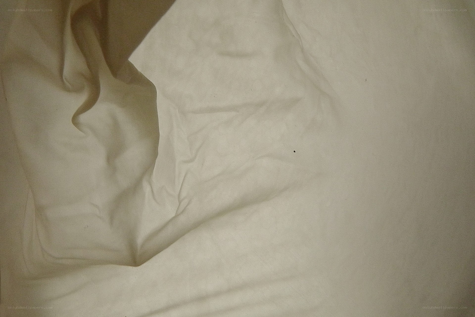 creased white fabric surface