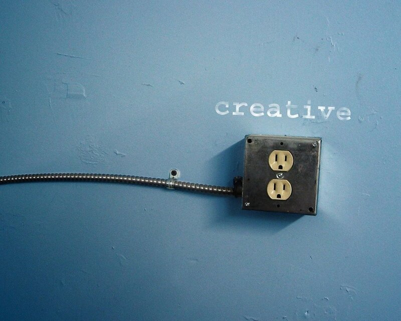 creative outlet on blue wall