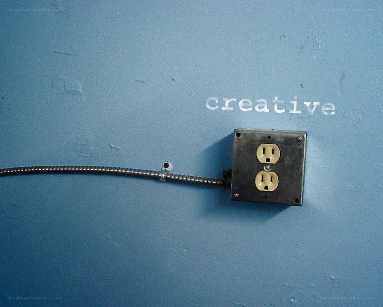 creative outlet on blue wall