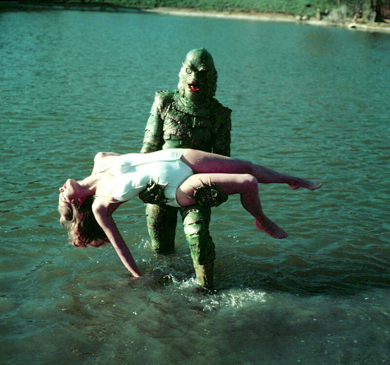 Creature Holding Woman