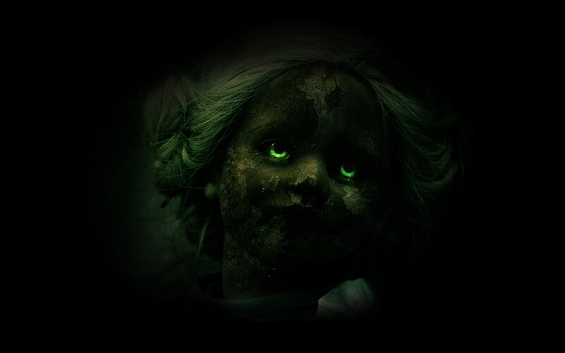 creepy doll with glowing eyes