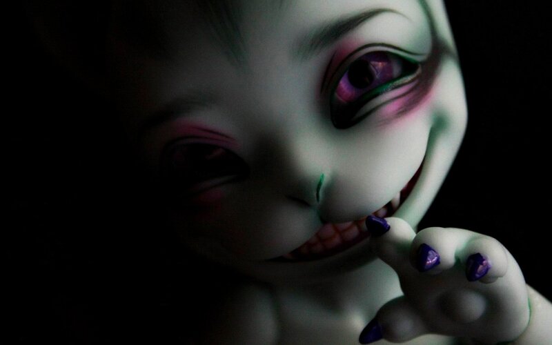 creepy doll with purple eyes