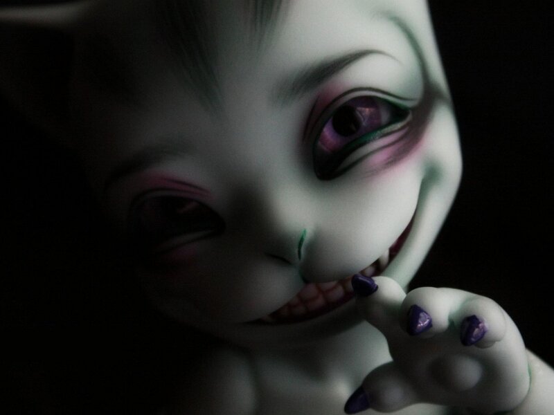 creepy doll with purple eyes
