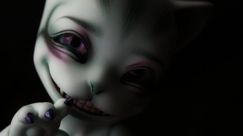 creepy doll with purple eyes