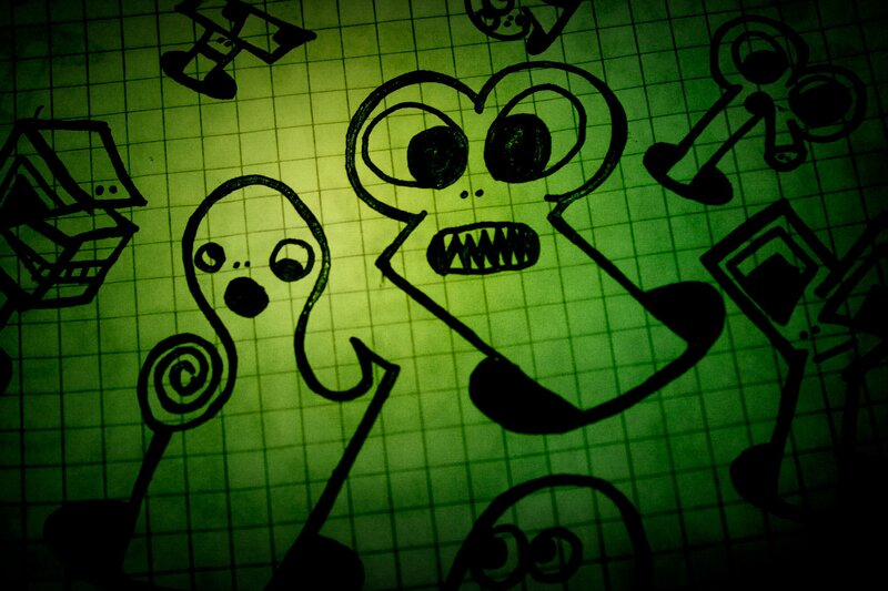 creepy doodles on graph paper