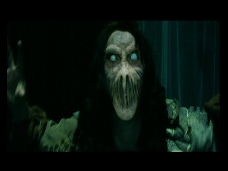 Creepy Figure with Glowing Eyes