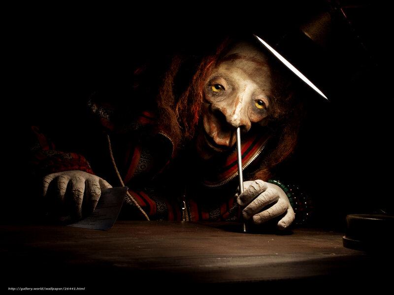 creepy figure writing at desk
