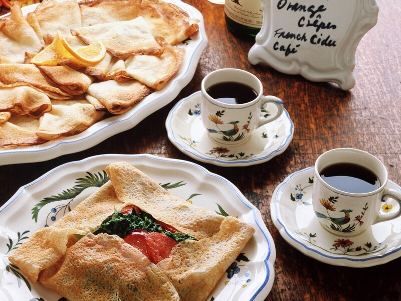 Crepes and coffee on a wooden table
