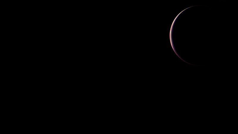 crescent moon in darkness