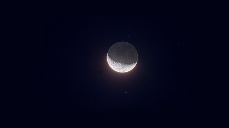 Crescent moon in night sky
