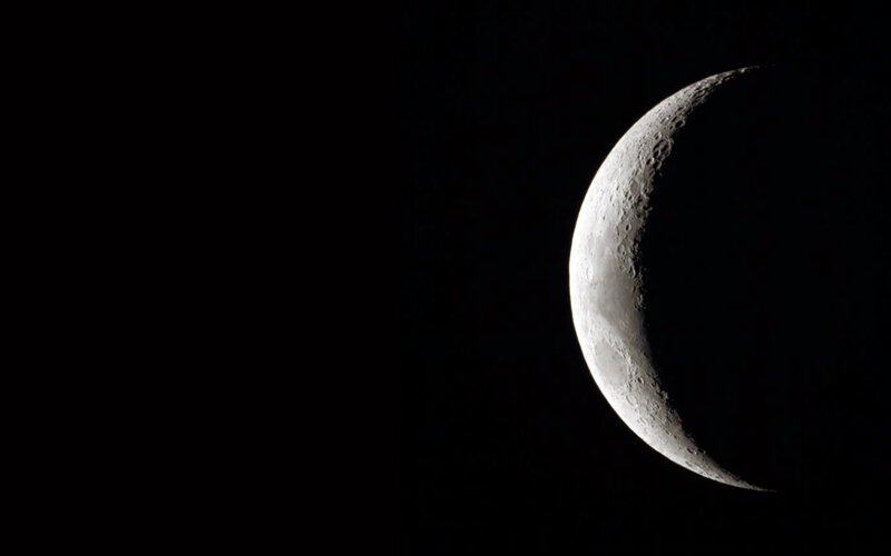 Crescent moon in space
