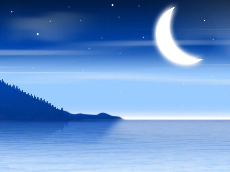 Crescent moon over calm lake