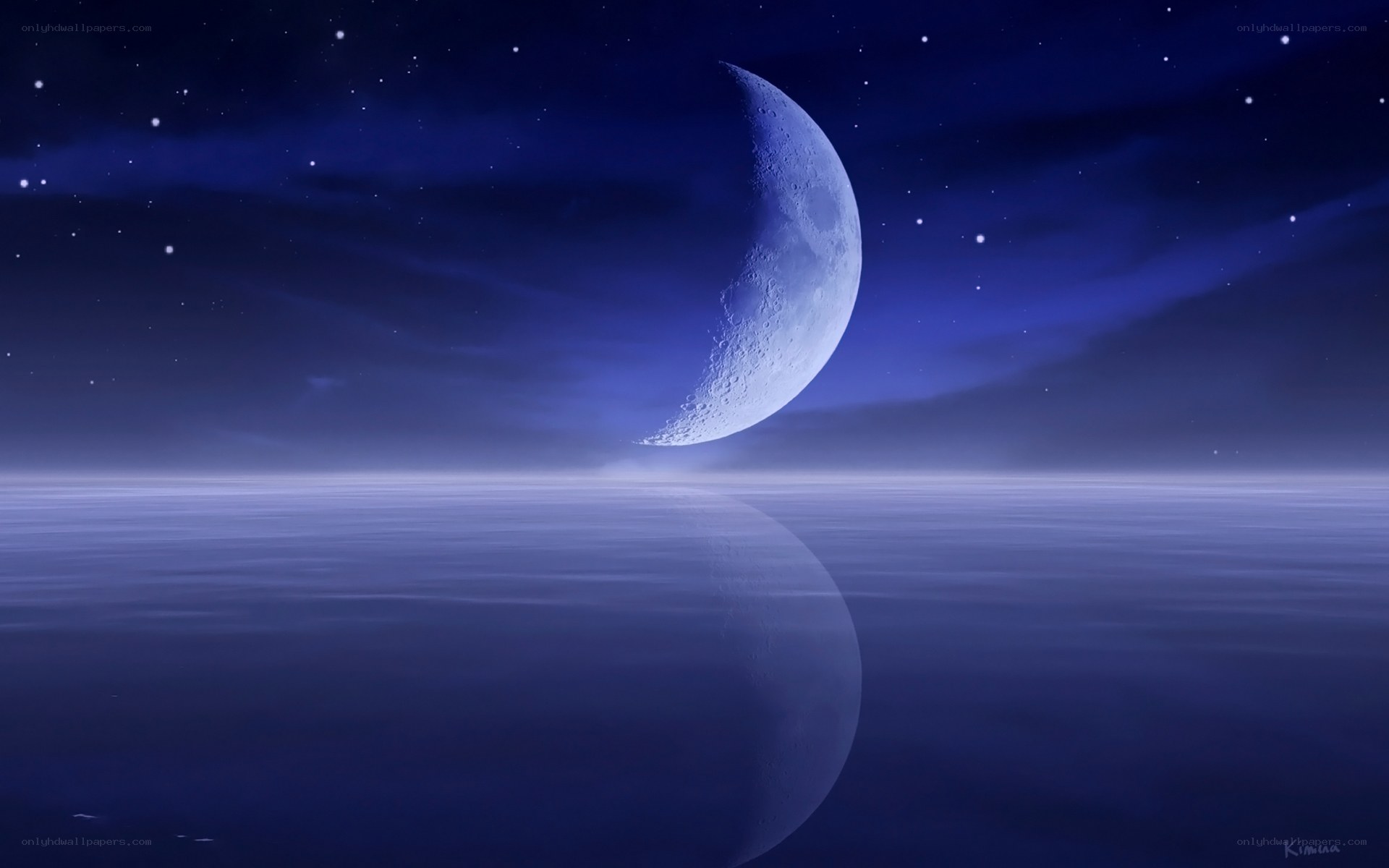 Crescent moon over calm sea