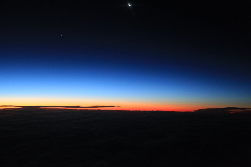 Crescent Moon over Clouds — Blue