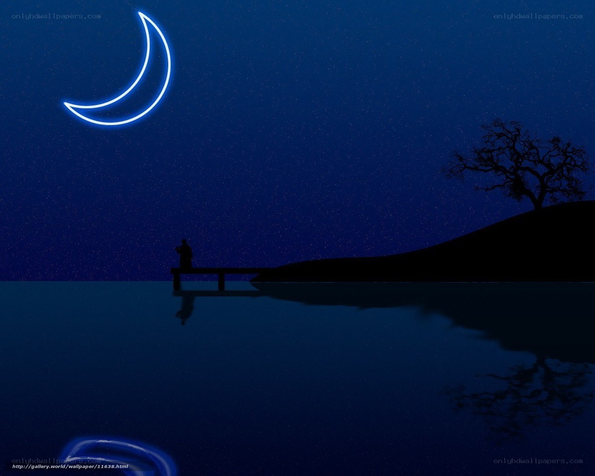 Crescent moon over lake