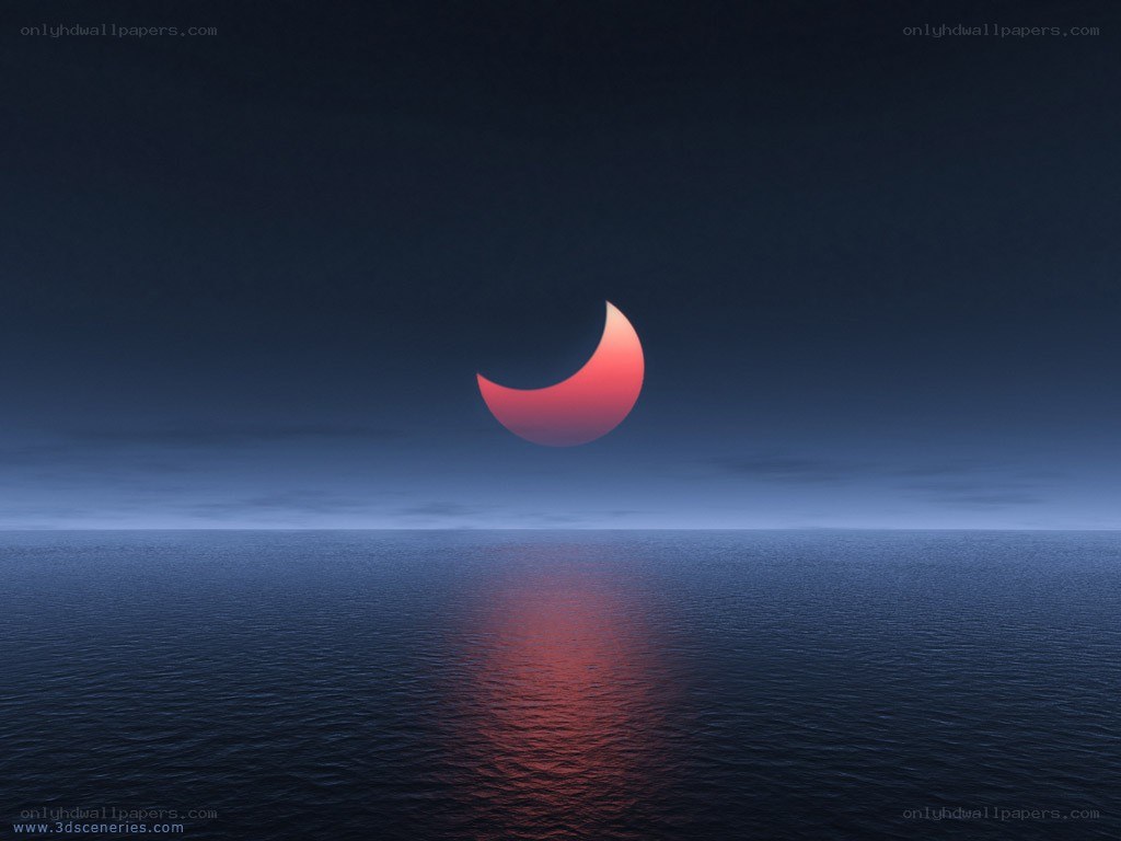 Crescent moon over ocean