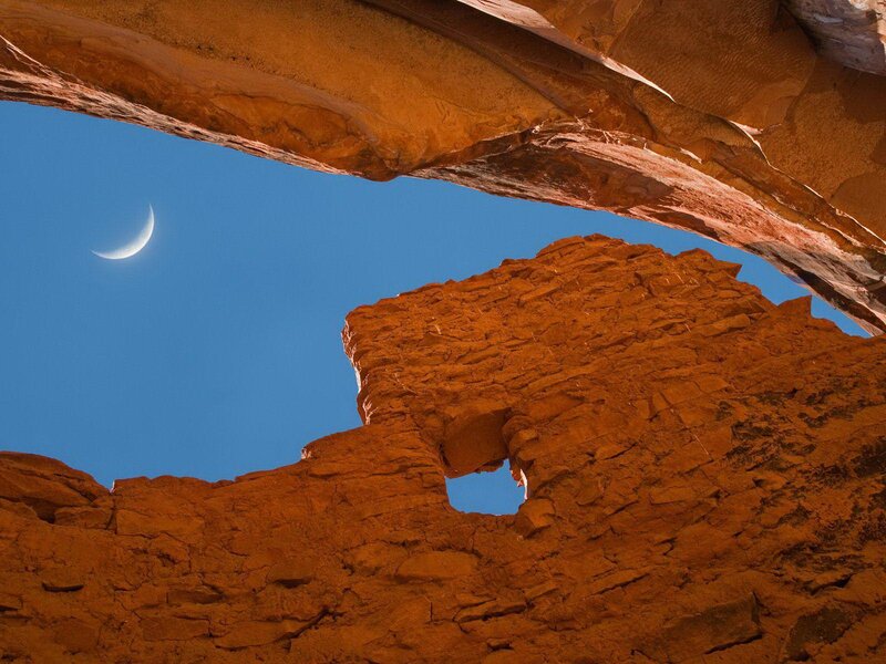 Crescent Moon Through Rock Arch