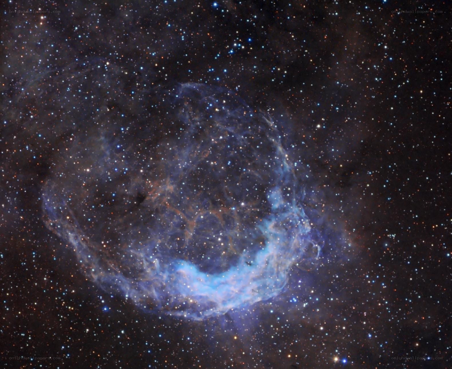 Crescent-shaped nebula in space