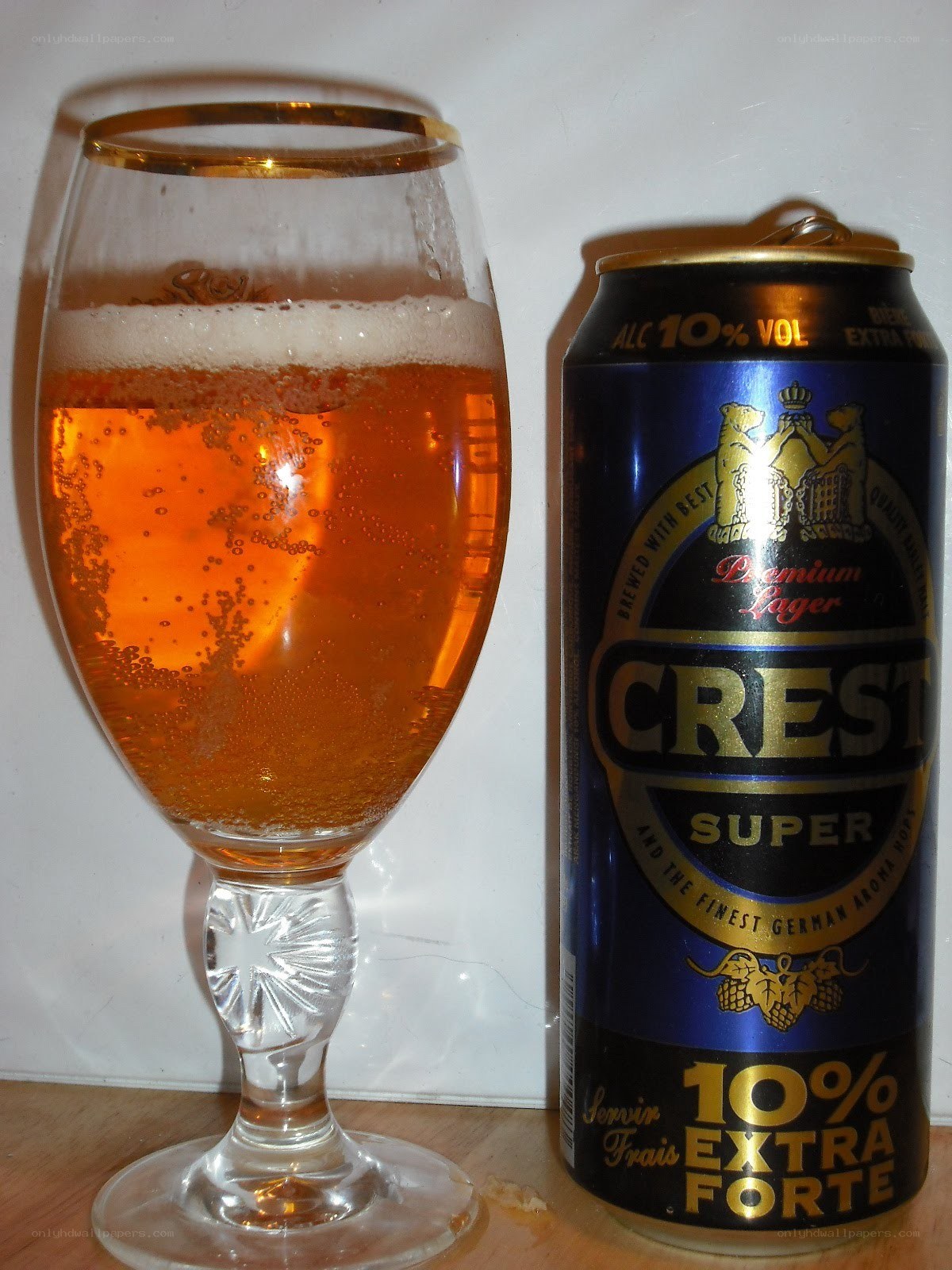 Crest Super beer can and glass