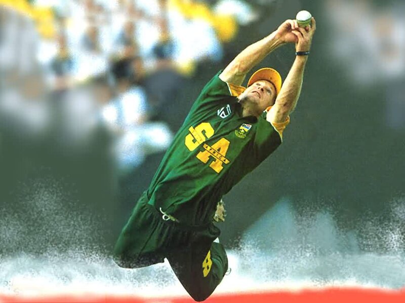 Cricketer Catching Ball