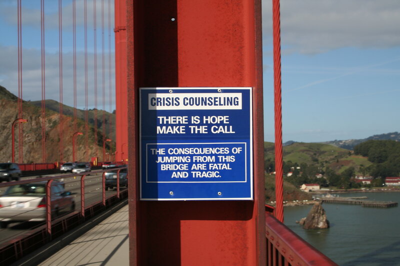 Crisis counseling sign on bridge