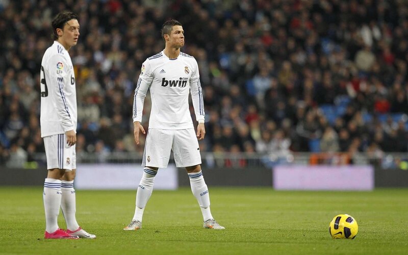 Cristiano Ronaldo and Mesut Ozil on the field