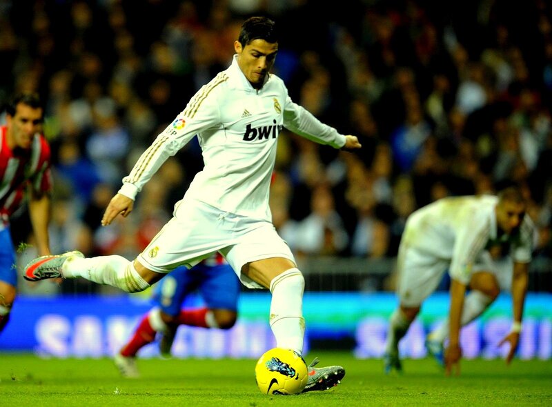 Cristiano Ronaldo kicking a soccer ball