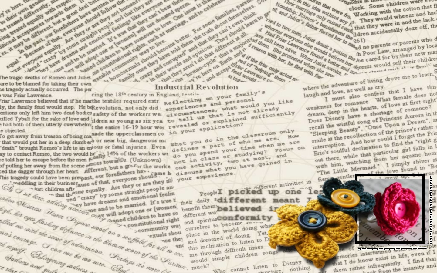 Crocheted flowers on newspaper