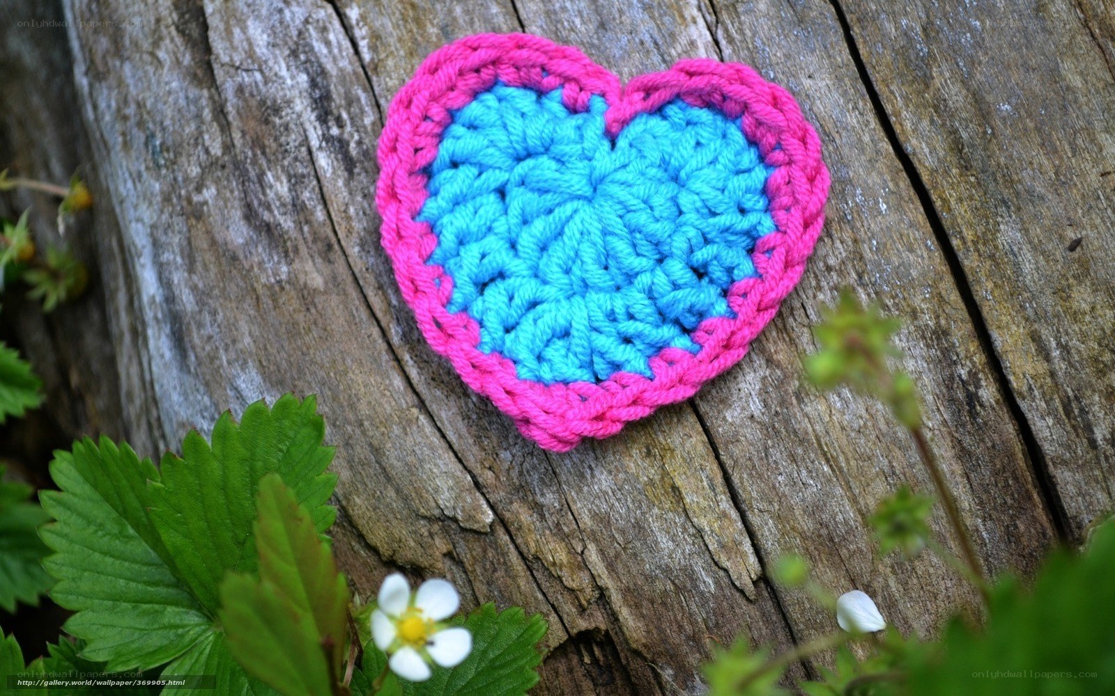 Crocheted heart on wood