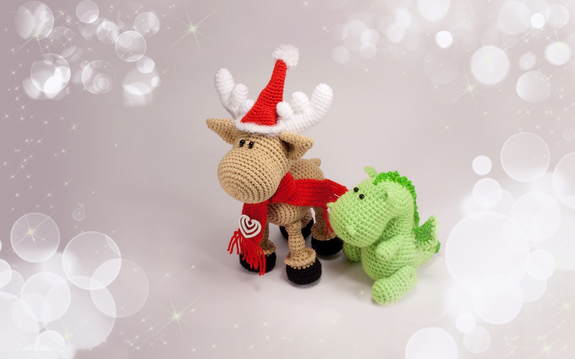Crocheted reindeer and dinosaur