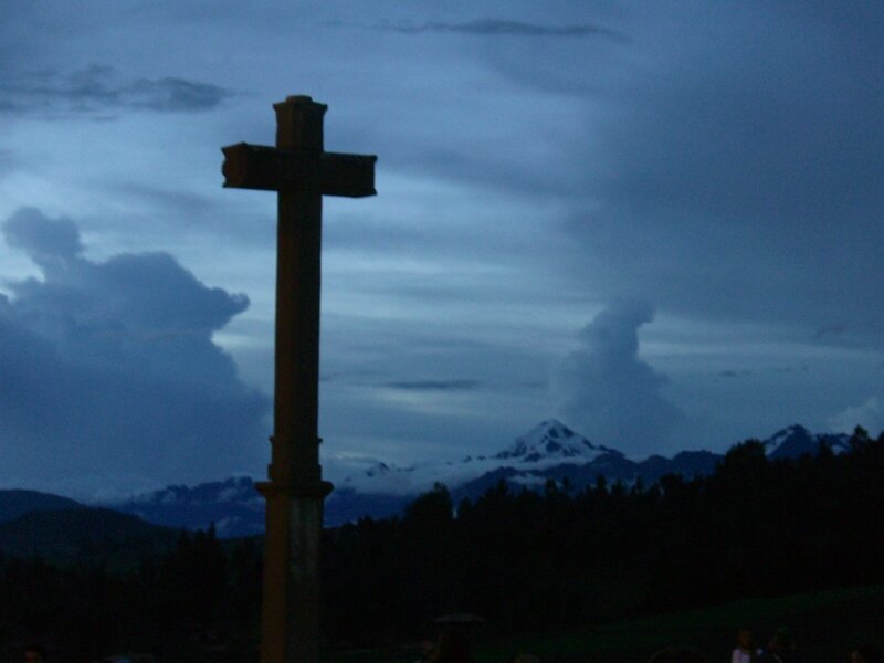 Cross against mountain backdrop