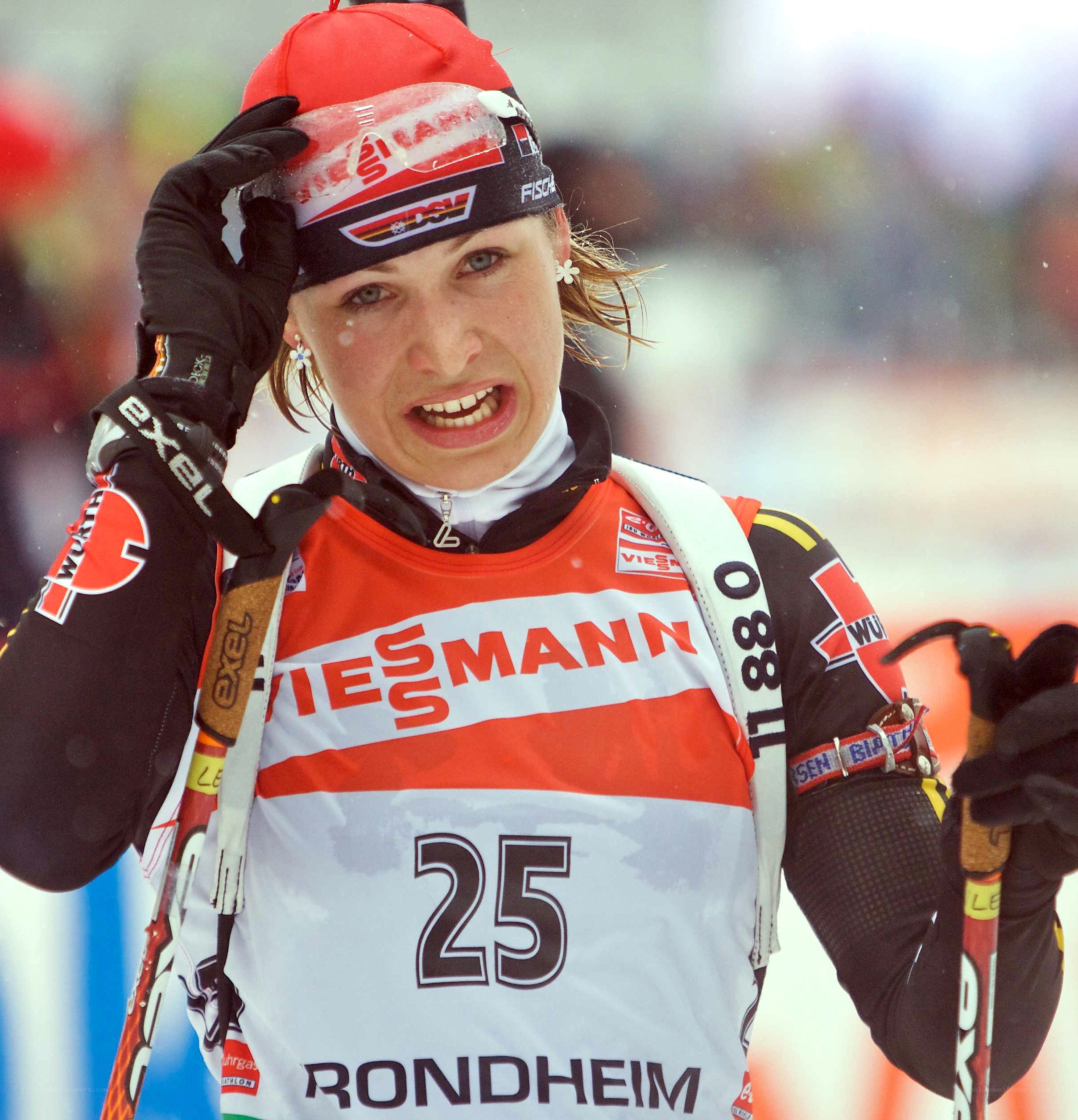 cross-country skier adjusting hat