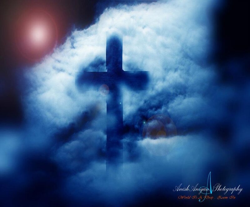 Cross in Cloudy Sky