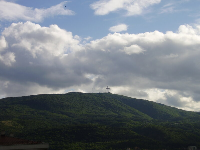 Cross on a green hill
